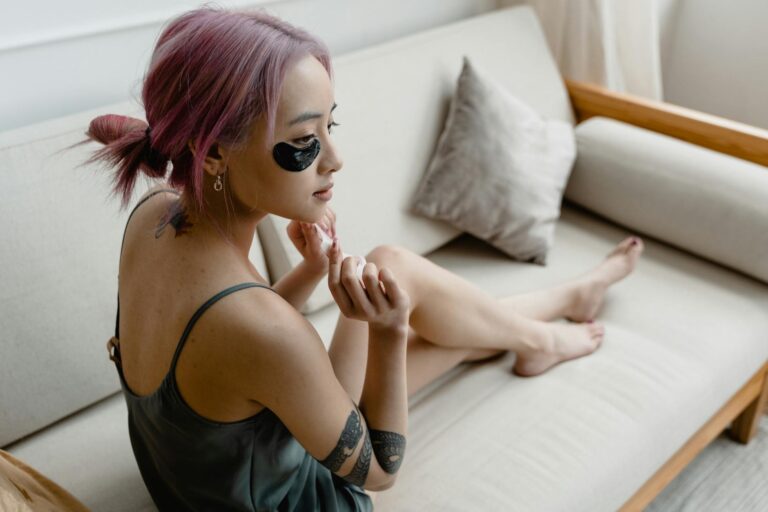 woman wearing heated eye mask relaxing
