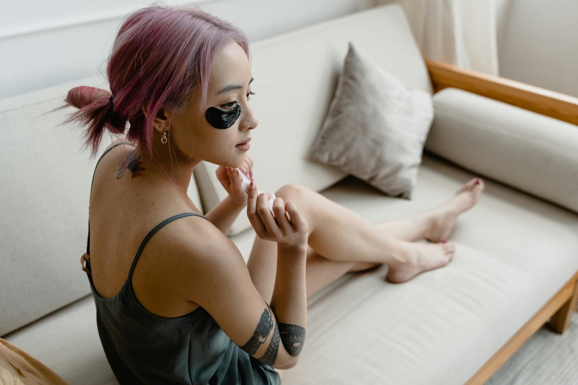 woman wearing heated eye mask relaxing
